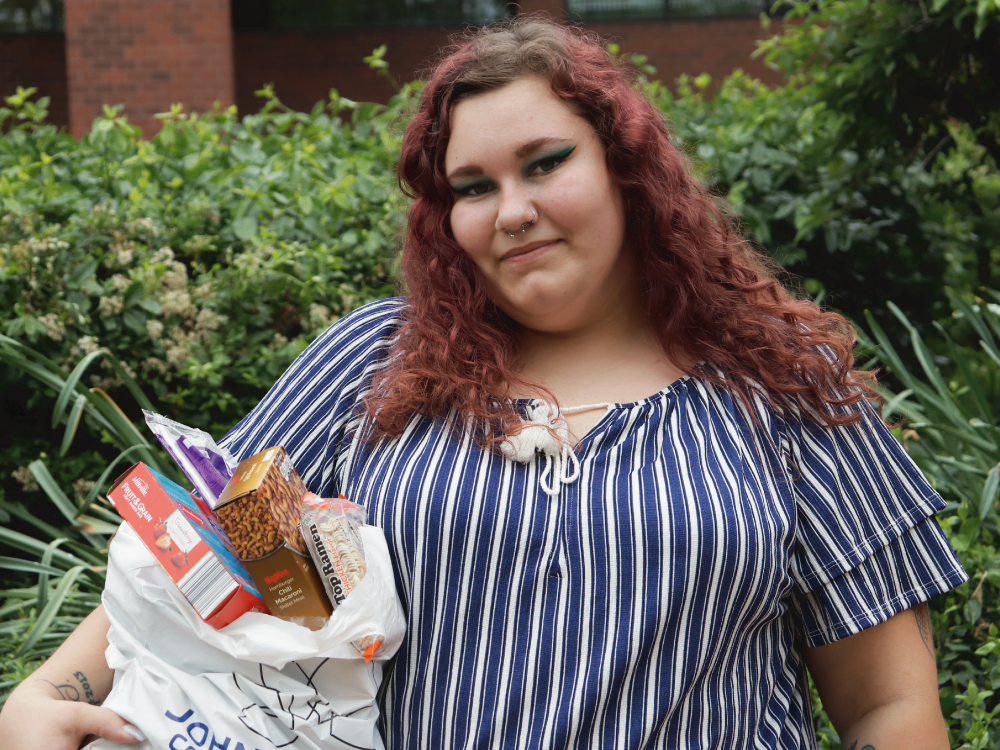 Woman Holding Bag of Food