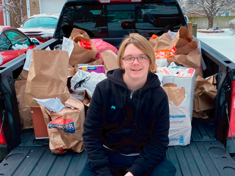 Young Man with Donation in Truck