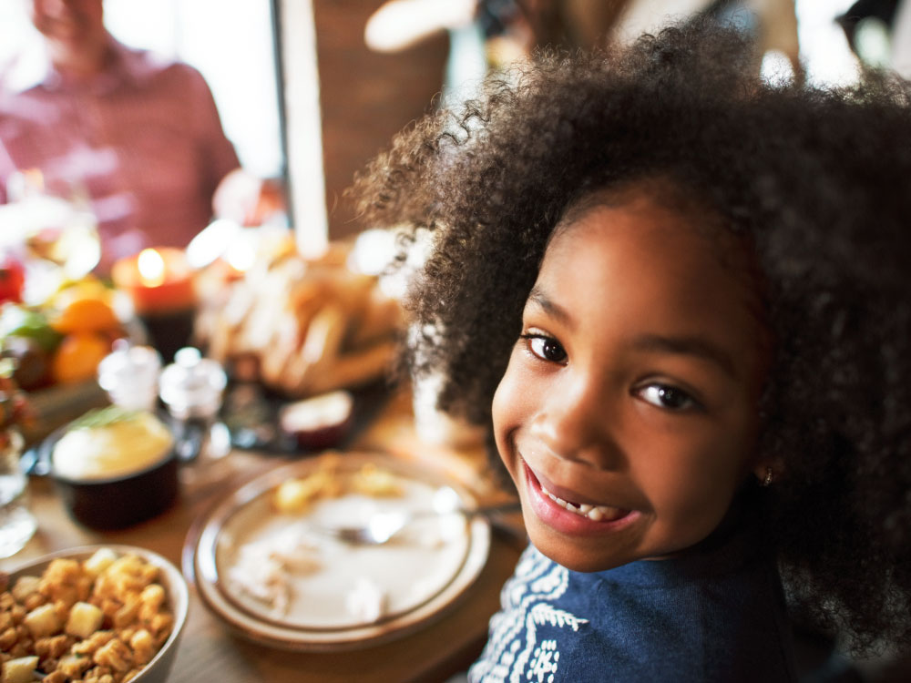Young Girl Eating Holiday Meal
