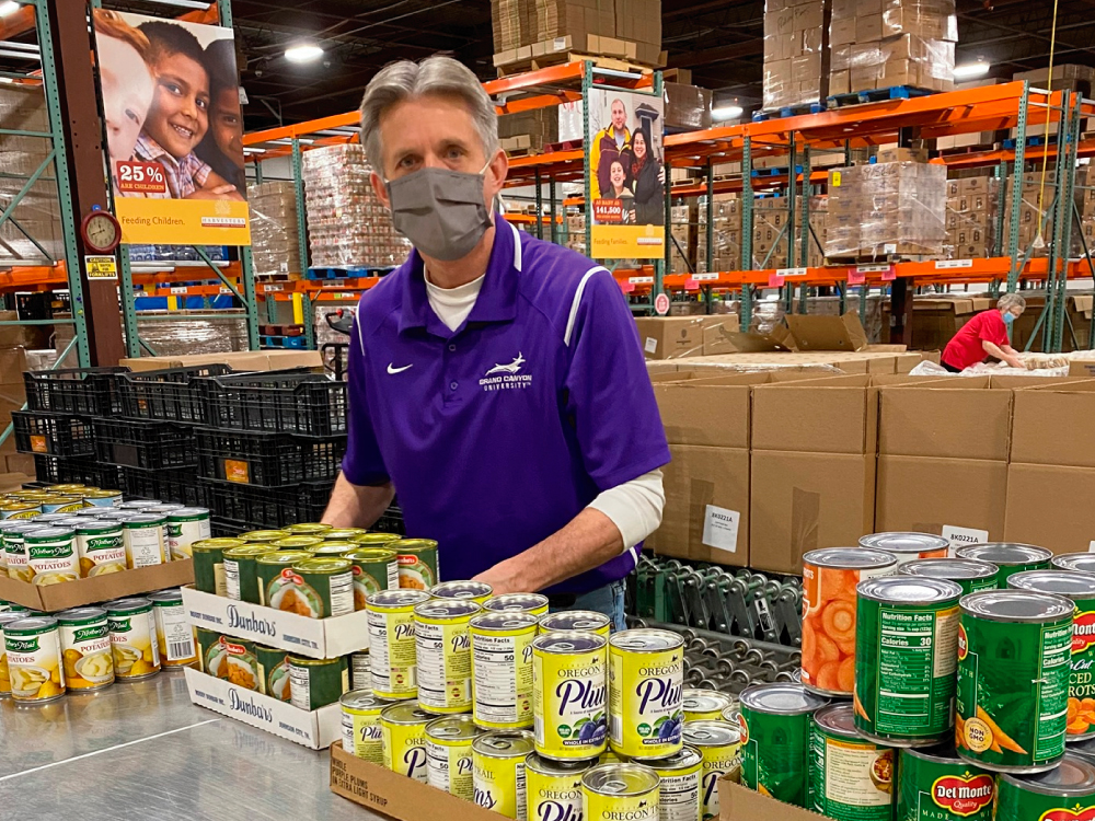 Man Packing Canned Food